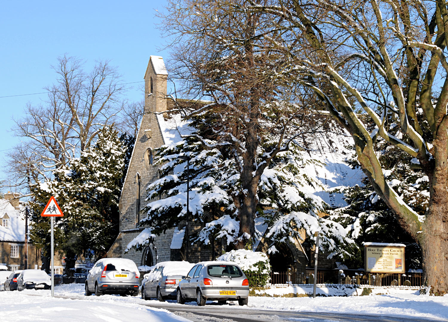 Holy Trinity parish church, Woodgreen, Witney, Oxfordshire, seen from the south in snow